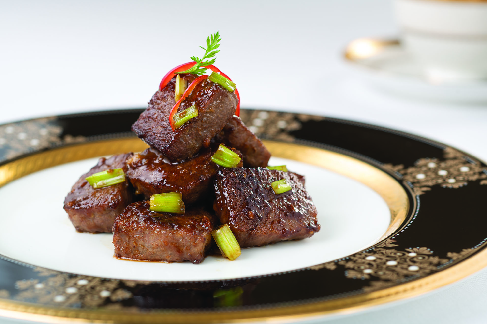 T'ang Court offers Stir-fried diced Japanese Wagyu beef with spring onion and wasabi.